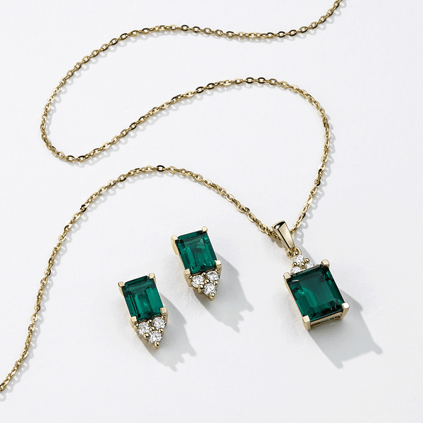 4 Ctw Emerald Cut Emerald Stud Earrings With Trio Moissanite Diamonds