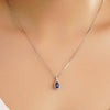1 CT. Pear Shaped Sapphire Pendant with Pavé Diamond Halo