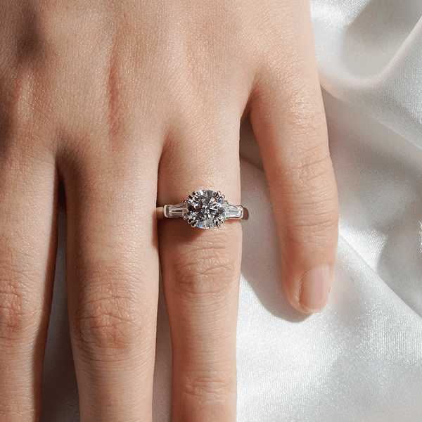 Round Cut Moissanite Engagement Ring with Tapered Baguette Side Stones