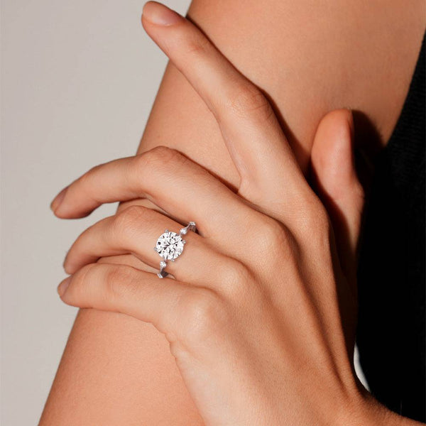 Round Cut Moissanite Ring with Diamond Spaced Band and Hidden Halo